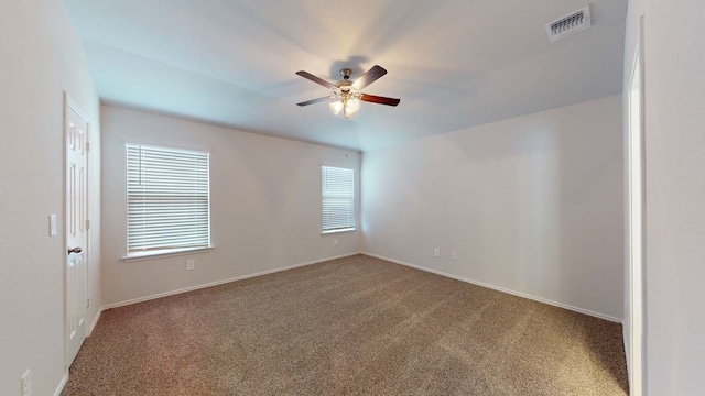 empty room featuring carpet and ceiling fan