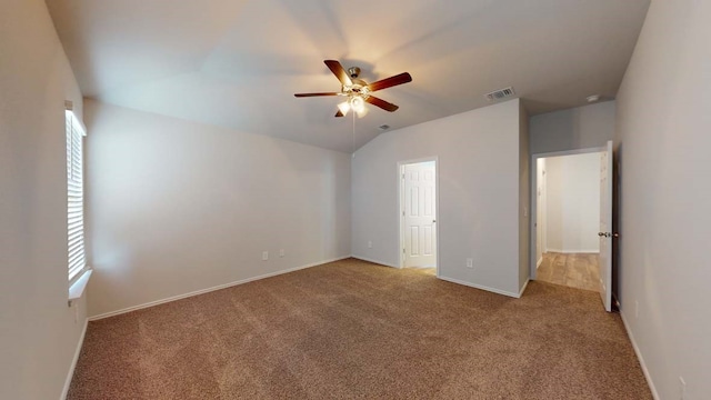 unfurnished bedroom with ceiling fan, carpet floors, and vaulted ceiling