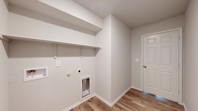 laundry area with washer hookup, gas dryer hookup, wood-type flooring, and hookup for an electric dryer