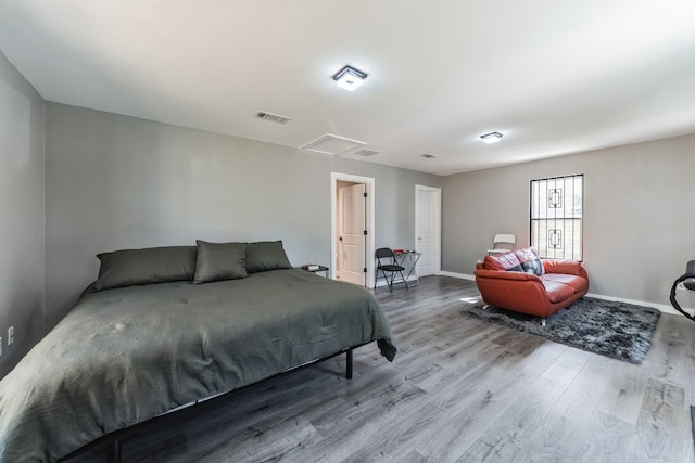 bedroom with wood-type flooring