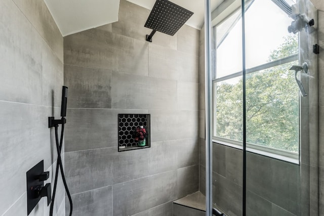 bathroom with tiled shower