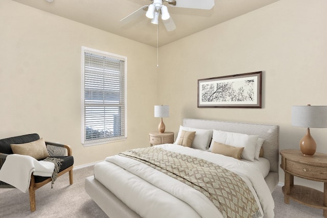 bedroom featuring ceiling fan and carpet