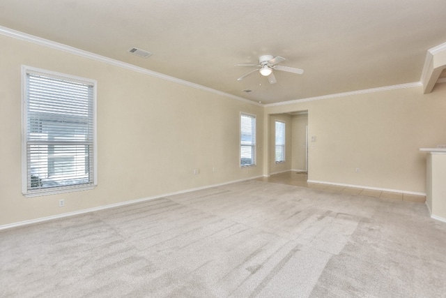 empty room with light carpet, ceiling fan, and ornamental molding