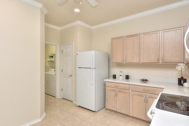 kitchen with light brown cabinetry, washer / clothes dryer, crown molding, light tile patterned floors, and white fridge