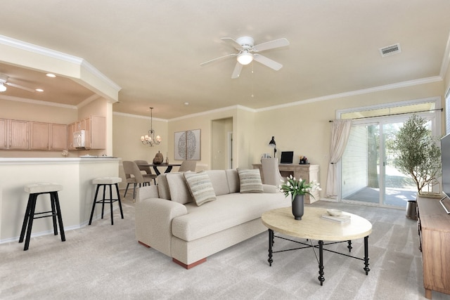 carpeted living room featuring ceiling fan with notable chandelier and ornamental molding