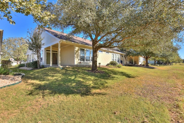 view of home's exterior featuring a yard