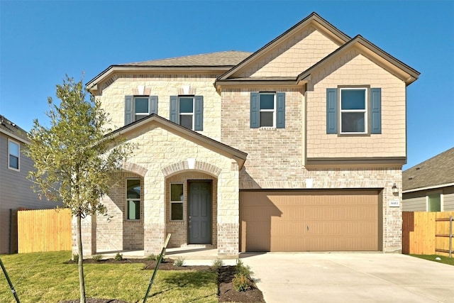 view of front facade featuring a front yard and a garage