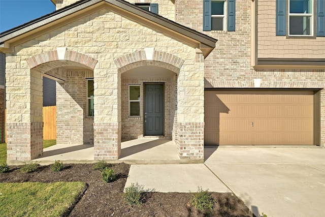 view of exterior entry featuring a garage