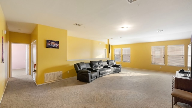 carpeted living room featuring a healthy amount of sunlight