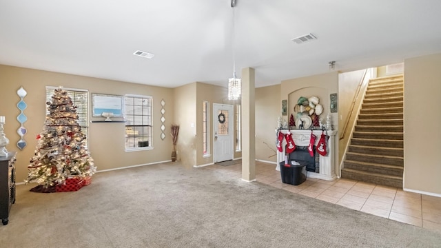 foyer with light colored carpet