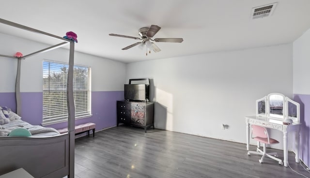 bedroom with ceiling fan and dark hardwood / wood-style flooring