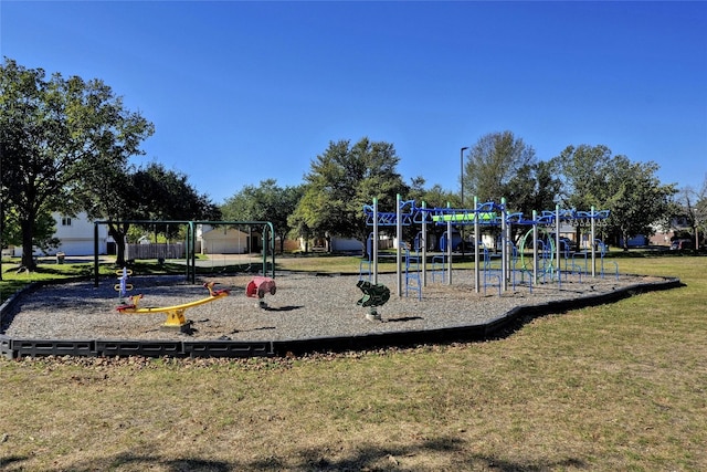 view of jungle gym featuring a lawn