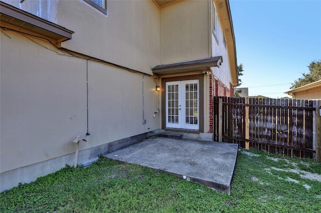 entrance to property with french doors and a patio