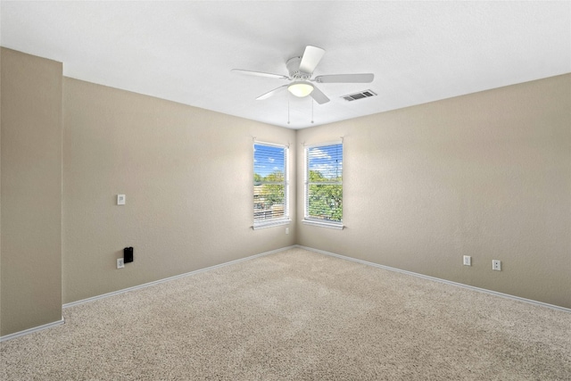 carpeted empty room with ceiling fan