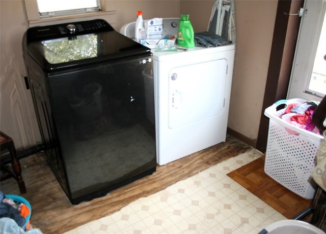 clothes washing area featuring washer and dryer