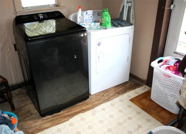 181 N Main St, Paige, TX 78659 - laundry area with separate washer and dryer and light wood-type flooring