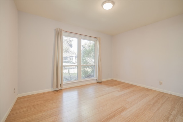 empty room with light wood-type flooring