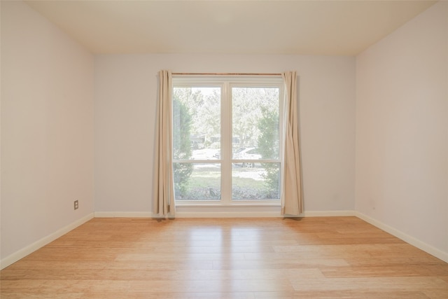 spare room with light wood-type flooring