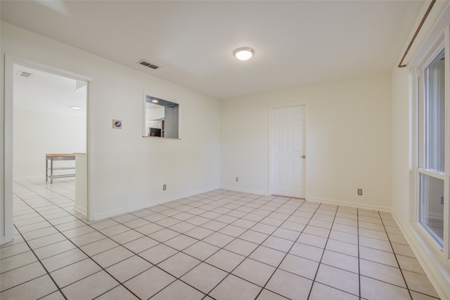 view of tiled spare room