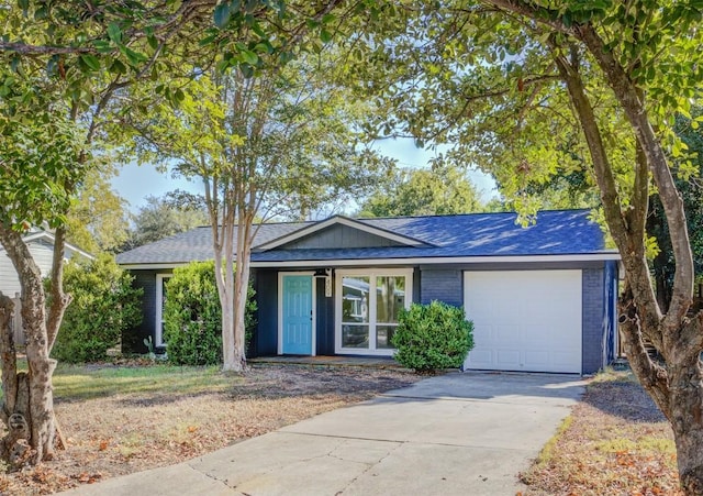 ranch-style home featuring a garage