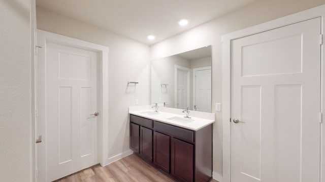 bathroom with vanity and hardwood / wood-style flooring