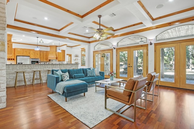 living room with french doors, ceiling fan, ornamental molding, and wood-type flooring