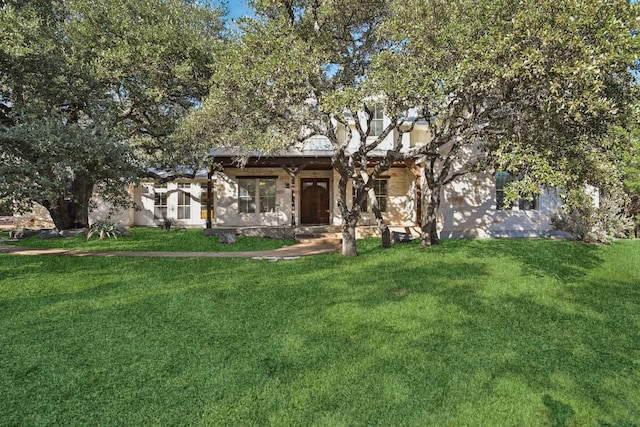 view of front of home with a front yard