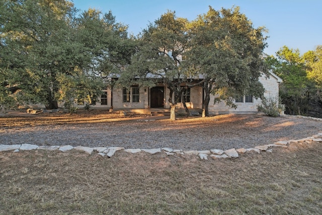 view of property hidden behind natural elements