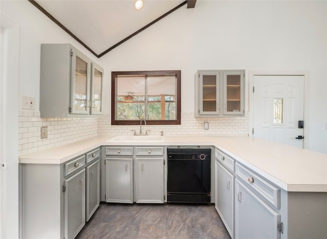 kitchen featuring backsplash, gray cabinetry, sink, and black dishwasher