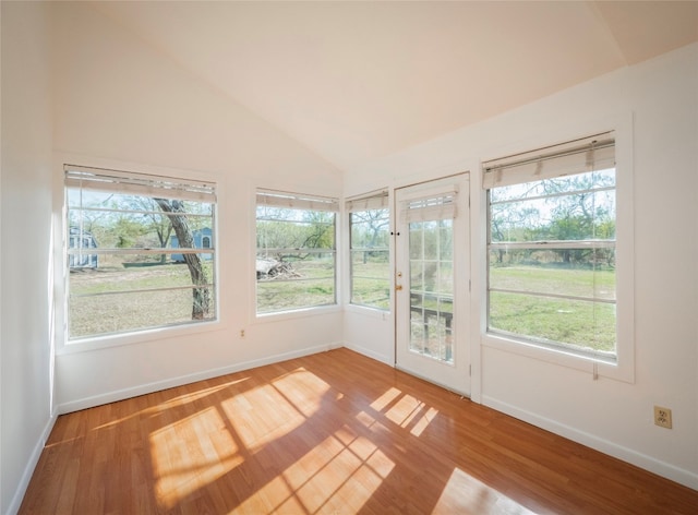 unfurnished sunroom with vaulted ceiling and a wealth of natural light