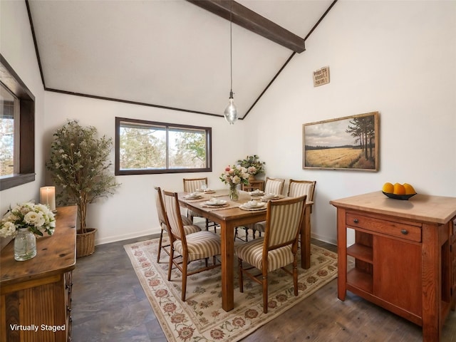 dining room featuring beam ceiling and high vaulted ceiling