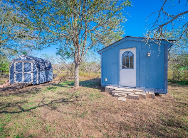 view of outbuilding featuring a lawn