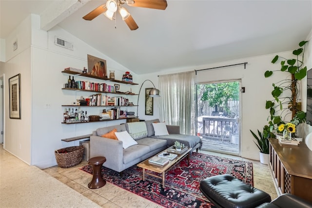 living room featuring lofted ceiling with beams, light tile patterned flooring, and ceiling fan