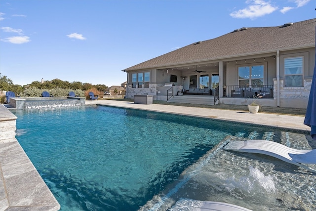 view of pool with ceiling fan and a patio area