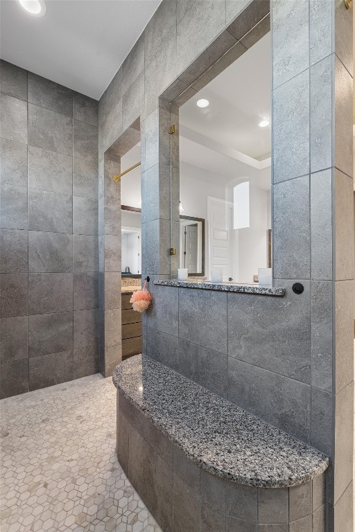 bathroom with tile walls