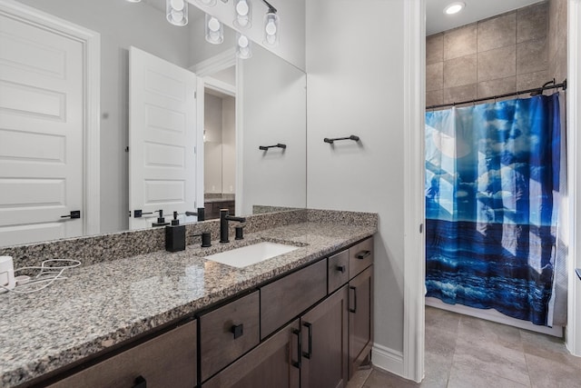 bathroom featuring tile patterned flooring and vanity