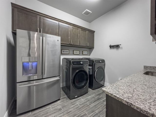 laundry room featuring washing machine and dryer