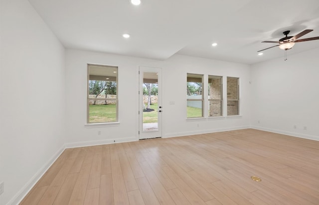 interior space featuring light wood-style floors, recessed lighting, baseboards, and a ceiling fan