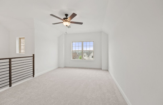 empty room featuring baseboards, a ceiling fan, and carpet flooring