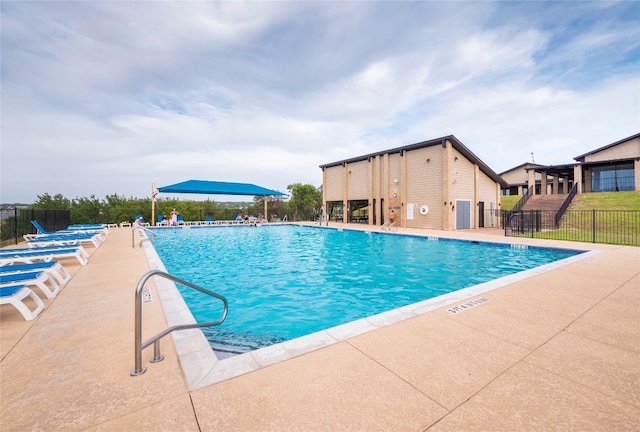 view of pool featuring a patio