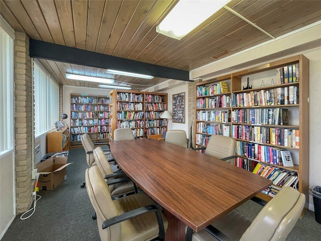 home office with wood ceiling and dark carpet