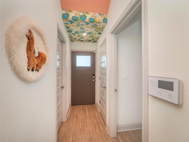 18802 Nicklaus Dr, Lago Vista, TX 78645 - doorway to outside with light wood-style flooring and baseboards