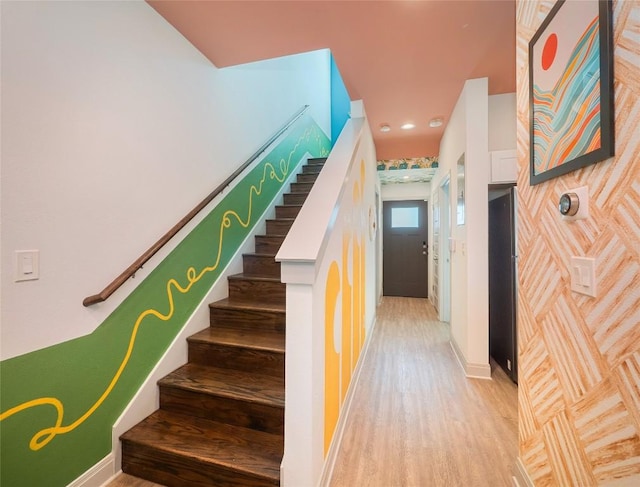 18802 Nicklaus Dr, Lago Vista, TX 78645 - staircase with wood finished floors, baseboards, and recessed lighting