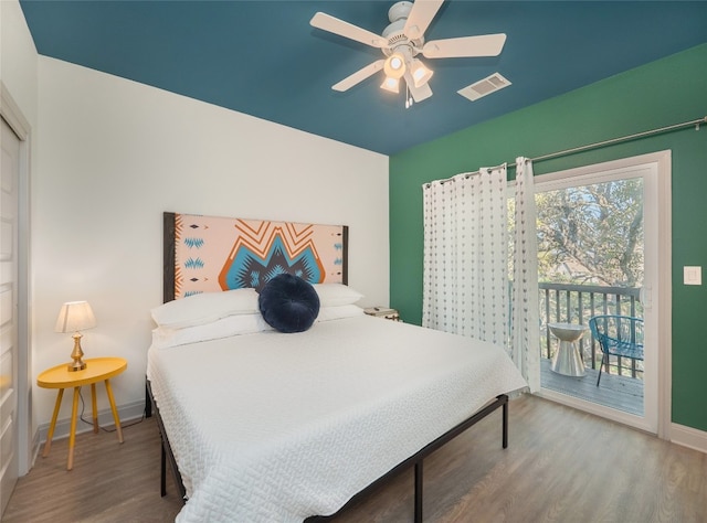 bedroom with access to exterior, ceiling fan, and wood-type flooring