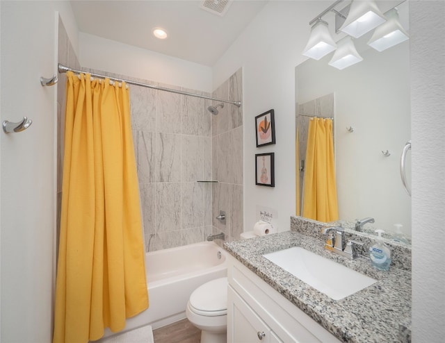 full bathroom with shower / bath combo, toilet, and vanity