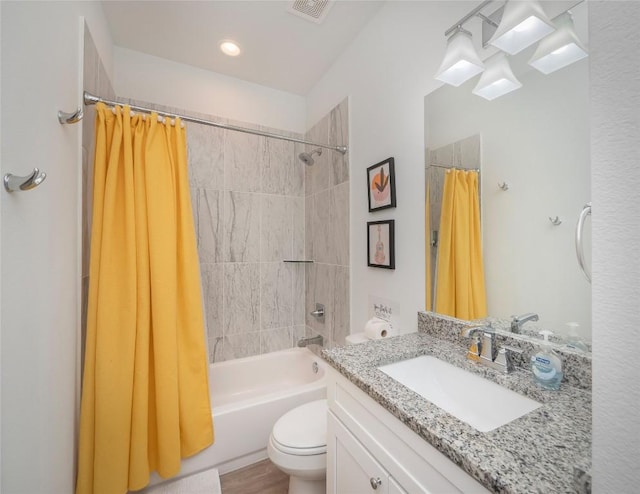 18802 Nicklaus Dr, Lago Vista, TX 78645 - bathroom with toilet, shower / bath combination with curtain, and vanity