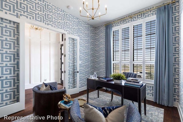 office area with a notable chandelier, dark hardwood / wood-style flooring, and french doors