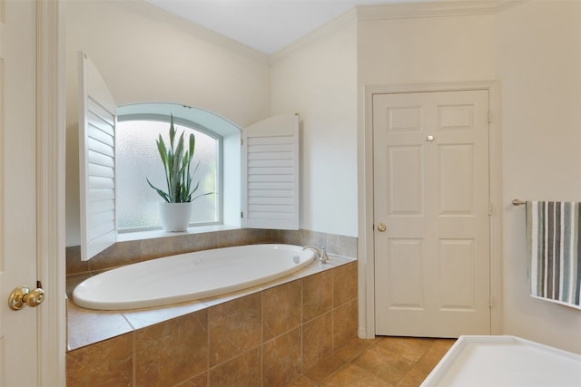 bathroom featuring crown molding, tile patterned flooring, and a relaxing tiled tub