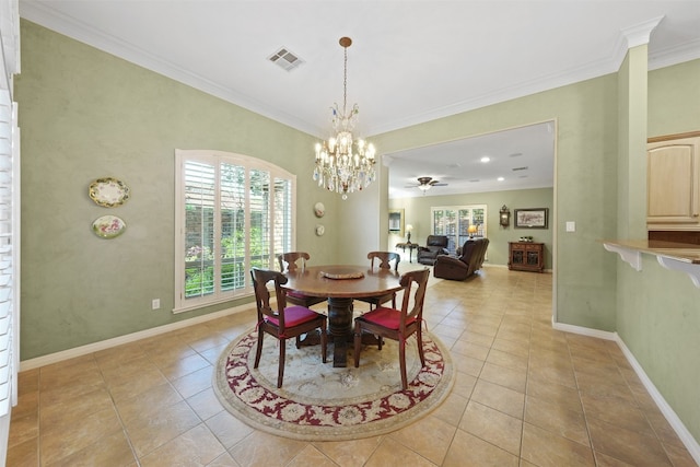 tiled dining room featuring crown molding, a healthy amount of sunlight, and ceiling fan with notable chandelier