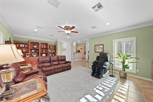 living room featuring ceiling fan and crown molding